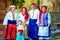 Portrait of happy ukrainian family in traditional costumes