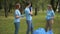 Portrait of happy volunteers chatting after park cleanup outdoors. Young proud Caucasian man and women standing on clear