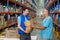 Portrait of happy volunteers holding a grocery bag