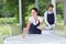 Portrait happy waiter and waitress standing in restaurant