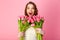 portrait of happy woman with bouquets of tulips