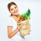 Portrait of happy woman with green vegan food in paper bag.