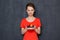 Portrait of happy woman holding saucer with plums and nectarine