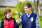 Portrait of happy woman and man with disability together on spring lawn