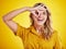 Portrait, happy woman and okay on eyes for good review, motivation and sign on yellow background. Female person, funny