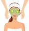 Portrait of happy woman receiving face massage at salon spa concept