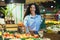 Portrait of happy woman shopper in supermarket, Hispanic woman chooses apples and fruits smiling and looking at camera