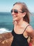 Portrait of happy woman tourist on the cliff