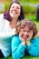 Portrait of happy women with disability on spring lawn