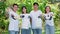 Portrait of happy young Asian students volunteers for cleaning park, forest and woods for healthy environment. Earth day, nature