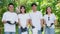 Portrait of happy young Asian students volunteers for cleaning park, forest and woods for healthy environment. Earth day, nature