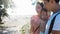 Portrait of happy young family with charming baby. Picnic on the beach