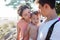 Portrait of happy young family with charming baby. Picnic on the beach.