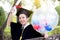 Portrait of happy young female graduates in academic dress