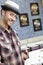 Portrait of a happy young male music store with book