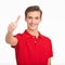 Portrait of happy young man showing thumbs up gesture, isolated over white background. Photo of smiling  Handsome white guy in a