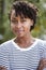 Portrait of happy young mixed race woman, vertical