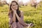 Portrait of a happy young woman in peach field