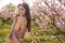 Portrait of a happy young woman in peach field