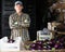 Portrait of a hardworking man, standing in a warehouse, going to sort harvested eggplants