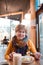 Portrait of healthy older woman eating at  restaurant