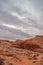 Portrait, Heavy gray cloudscape over red rocks, Valley of Fire, Nevada, USA