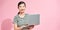 Portrait of her she nice attractive pretty focused cheerful lady IT specialist holding in hands laptop