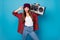 Portrait of her she nice attractive pretty funky cute comic naughty cheerful cheery girl carrying boombox showing tongue