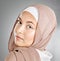 Portrait of hijab wearing traditional muslim woman in arabic style in studio. Headshot of proud cultural arab with
