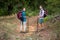 Portrait of hiker couple standing with hiking pole