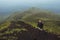 Portrait of hiker man posing on the mountain, freedom concept. A