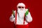 Portrait of his he attractive cheerful cheery funny fat white-haired Santa holding in hand beer bottles invite festal