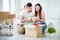 Portrait of his he her she nice attractive lovely cheerful focused couple buyers packing belongings things stuff writing