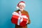 Portrait of his he nice attractive cheerful cheery bearded grey-haired Santa father giving you Eve Noel December giftbox