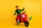 Portrait of his he nice attractive cheerful cheery ecstatic funny guy elf riding moped having fun fooling rejoicing