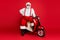 Portrait of his he nice bearded cheerful cheery funky fat oversized Santa Claus hipster sitting on motor bike winter