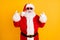 Portrait of his he nice funny comic cheerful cheery white-haired Santa St Nicholas showing double horn sign having fun