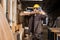 portrait hispanic indian confident worker work in construction site with wooden pile, wood furniture factory worker