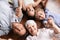 Portrait, holding hands or grandparents on the floor with happy kids smiling together in family home. Grandma in