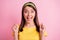 Portrait of hooray pretty brunette girl hands fists yell wear yellow cloth isolated on pastel pink color background