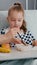 Portrait of hospitalized little chid lying in bed in recovery examination room