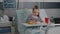 Portrait of hospitalized little child resting in bed eating healthy food meal during recovery examination