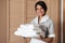 Portrait of a hotel maid holding fresh clean folded towels