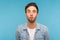 Portrait of humorous funny man in worker denim shirt making amazed grimace with comical fish face