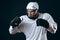 Portrait of ice-hockey player standing in boxing defensive stance.