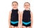 Portrait of identical twin girls dressed in rhythmic gymnastics dress