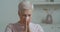 Portrait ill upset mature old caucasian woman sneeze blow running nose hold white tissue, flu coronavirus concept. Sick