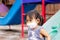 Portrait image of 2-3 yeas old baby. Happy Asian child girl smiling and wearing fabric mask. She playingâ€‹ at the playground.