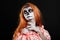 Portrait image of redhead woman, who is ready for the Halloween.