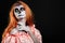 Portrait image of redhead woman, who is ready for the Halloween.